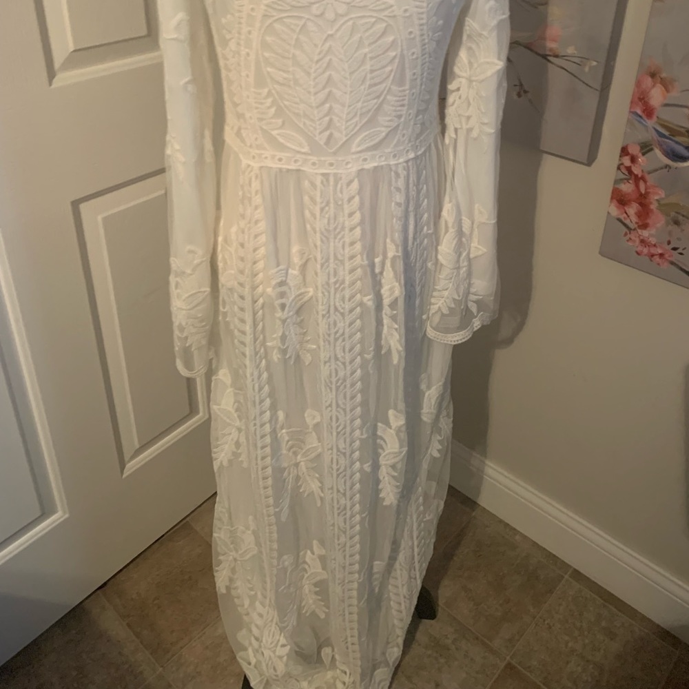 Boho new w/tags wedding dress, slight pull apart…can be easily sewn, size s/m